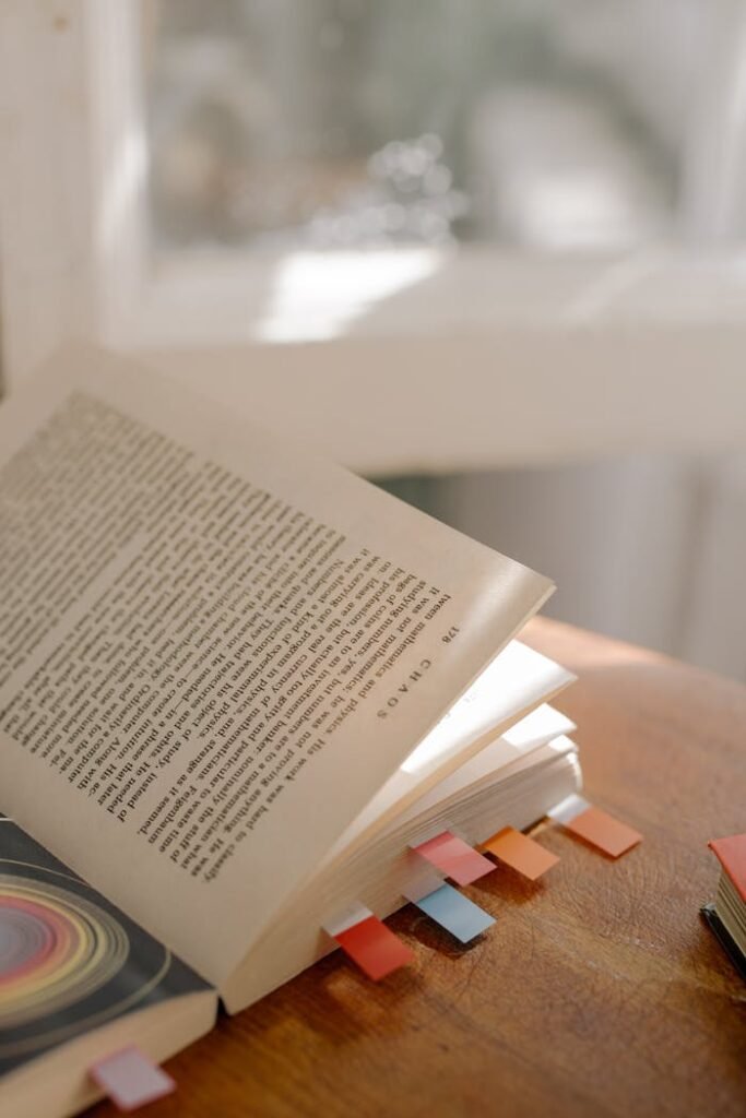 White Book Page on Brown Wooden Table